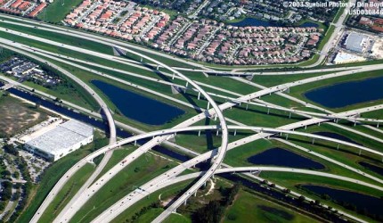 The Sawgrass Expressway (bottom left) - I-75 (middle right) - I595 (upper left) interchange in western Broward County from U S Airways A320 N111US on August 12, 2003. 

Sunbird Photos by Don Boyd stock #USD030846.